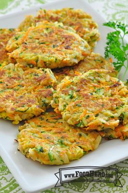 some food is on a white plate with green garnishes and parsley