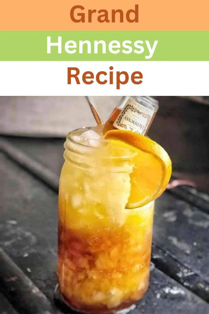 a mason jar filled with oranges and lemonade on top of a wooden table