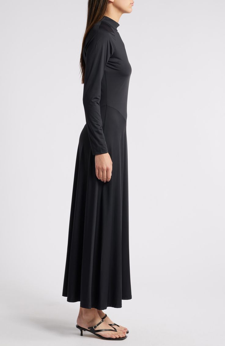 Asymmetric seams lend modern style to this versatile maxi dress boasting sumptuous stretch for event-ready comfort. 54 1/2" length (size Medium) Back keyhole with button-and-loop closure Mock neck Long sleeves Unlined 87% nylon, 13% spandex Dry clean Imported Fitted Sleek Maxi Dress, Sleek Fitted Maxi Dress, Sleek Full-length Bias-cut Maxi Dress, Sleek Fitted Maxi Dress In Elastane, Sleek Fitted Maxi Dress Made Of Elastane, Asymmetrical Fitted Maxi Dress For Evening, Sleek Stretch Maxi Dress With Flattering Silhouette, Fitted Maxi Dress With Side Slits For Work, Formal Long Maxi Dress With Side Slits