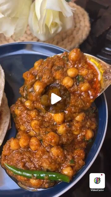 a blue plate topped with beans and tortilla