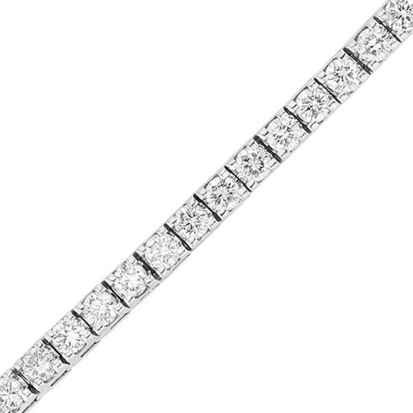 Thrill her with the wearable luxury of this shimmering diamond tennis bracelet. Crafted in cool 14K white gold, this extraordinary streamlined design features dazzling 1/8 ct. diamonds, each with a color rank of I and clarity of I1. Captivating with 6 ct. t.w. of diamonds and a bright polished shine, this stylish 7.0-inch tennis bracelet closes securely with a box clasp. Timeless White Diamond Bracelet In Platinum, Timeless White Diamond Platinum Bracelet, White Diamond Bracelet With Brilliant Cut, Timeless White Diamond Bracelet With Brilliant Cut, White Brilliant Cut Diamond Bracelet, Dazzling White Gold Tennis Bracelet In Platinum, Modern Diamond Tennis Bracelet For Formal Occasions, White Timeless Diamond Bracelet With Single Cut Diamonds, Timeless White Diamond Bracelet With Single Cut Diamonds