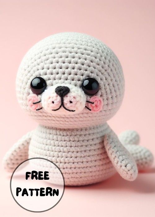 a small crocheted stuffed animal sitting on top of a pink background with the caption free pattern