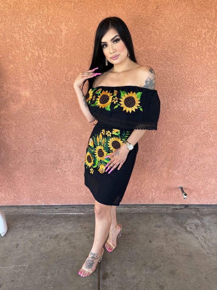 This Beautiful Off the Shoulder Mexican Dress is the perfect Party dress. It's lightweight with elastic around the shoulder and ties on the back for an adjustable fit. It is embroidered with vibrant Sunflowers and has lace details. Traditional Mexican Dress, Dama Dresses, Sunflower Dress, Gold And Black Dress, Quince Ideas, Mexican Dress, Traditional Mexican, Mexican Dresses, Gold Dress