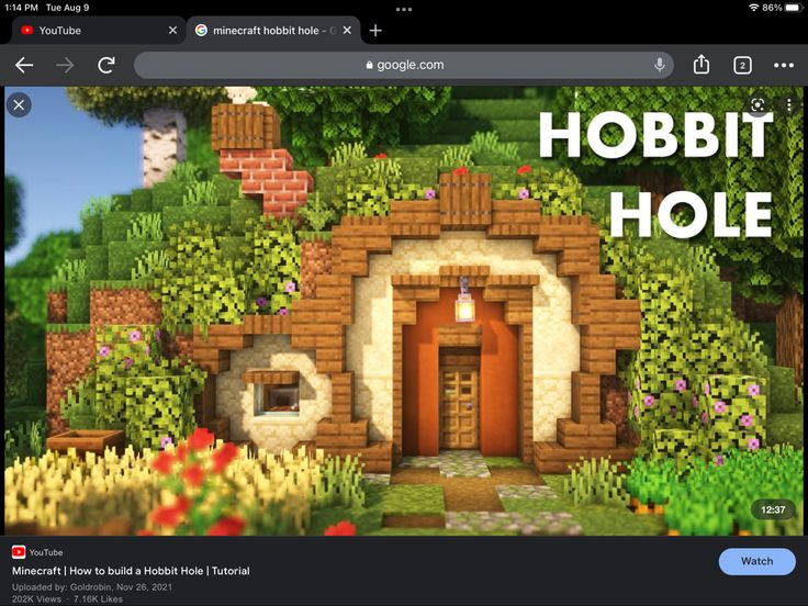 a computer screen with an image of a hobbit hole in the middle and text overlay