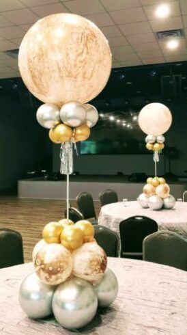 a table with some balloons on top of it