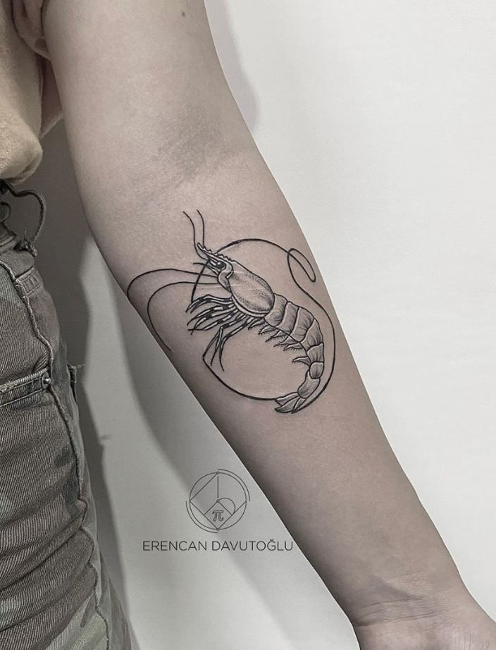 a woman's arm with a tattoo on it that has a lobster in the middle