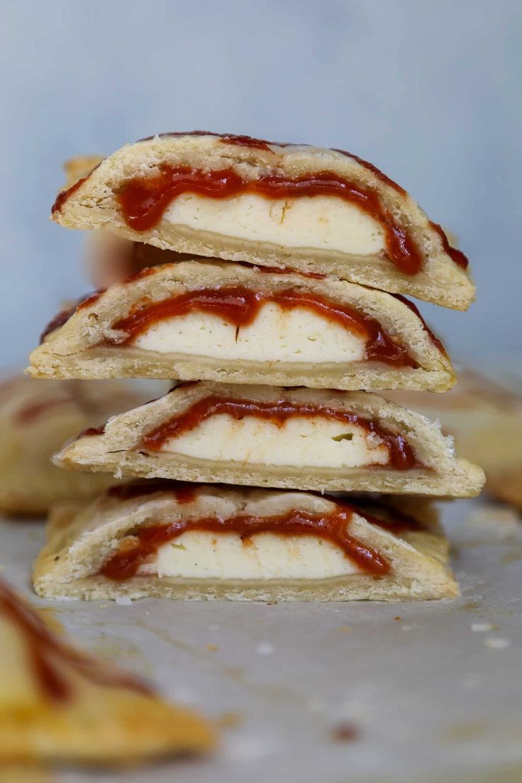 some food is stacked on top of each other with ketchup and mayonnaise