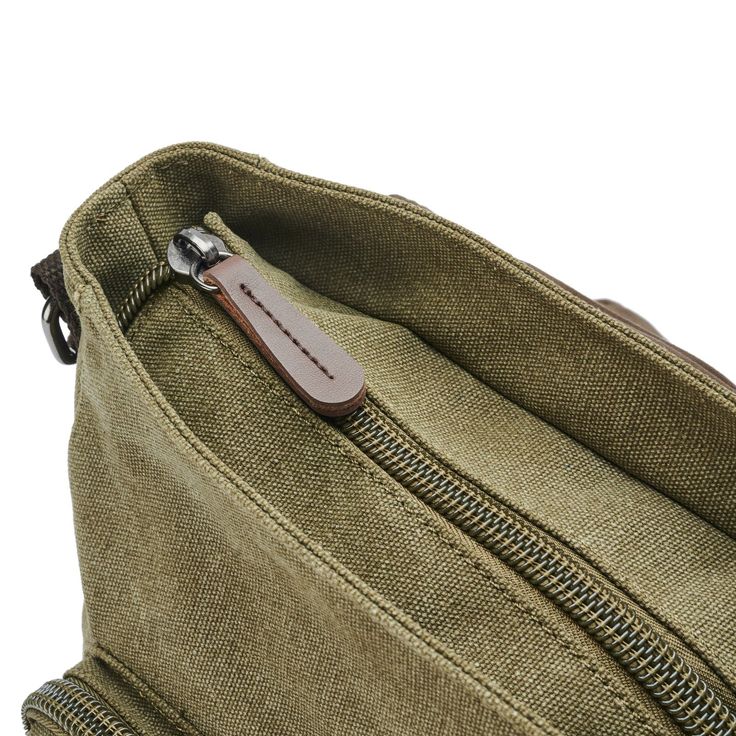 This vintage-inspired messenger bag suits all your daily needs, thanks to its spacious interior. Outfitted with zips on the back, the flap, and inside, with pockets for your phone, cards, and stationery. Inside, a laptop compartment keeps your electronics safe – perfect for the urban gentleman. Crafted from durable canvas with supple leather highlights and lined with soft nylon. Adjust the straps for a comfortable fit on any adventure. Classic Travel Shoulder Bag With Cell Phone Pocket, Classic Shoulder Bag With Cell Phone Pocket For Travel, Classic Camera Bag With Zipper For Travel, Travel Shoulder Bag With Cell Phone Pocket And Flap, Travel Briefcase With Interior Card Slots, Vintage Satchel Shoulder Bag With Cell Phone Pocket, Everyday Flap Satchel With Zipper Closure, Casual Travel Shoulder Bag With Card Slots, Casual Travel Shoulder Bag With Interior Card Slots