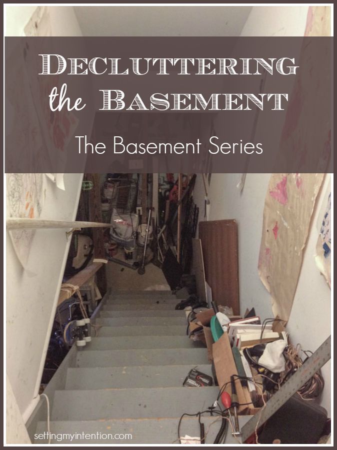 an image of a staircase with the words decluttering the basement