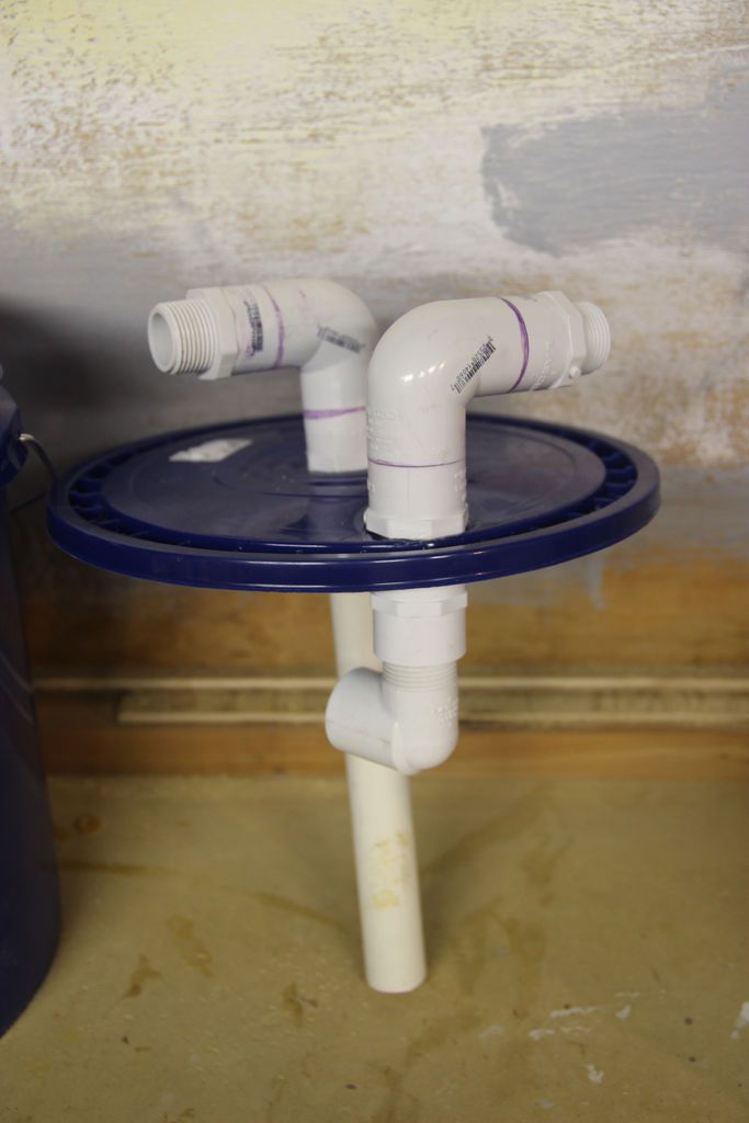 a blue table with two white pipes on it