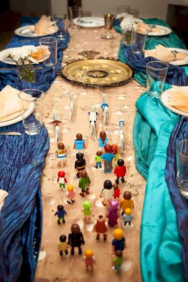 the table is set with many small figurines