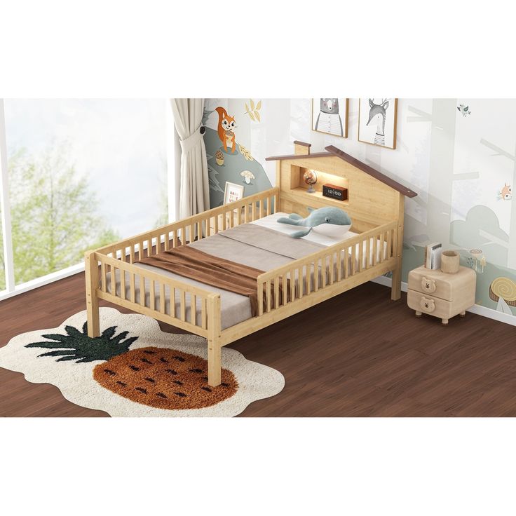 a child's wooden bed with pineapple rug on the floor next to it