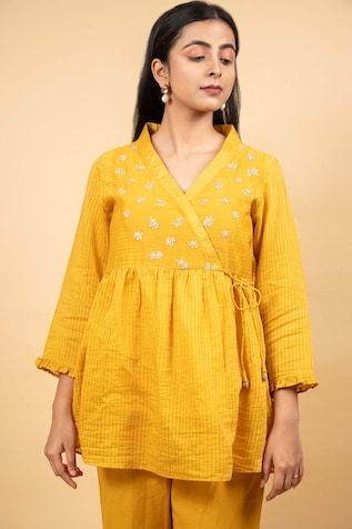 Mustard tunic featuring floral and sequin hand embroidery on the front yoke with stripe pattern all over. Paired with a coordinating pant and an inner slip. - Aza Fashions Cotton Long Sleeve Tops With Zari Work, Cotton Anarkali Top With Long Sleeves, Anarkali Straight Kurta Tops For Summer, Long Sleeve Cotton Tops With Zari Work, Cotton Tops With Zari Work, Summer Designer Tops With Mirror Work, Summer Designer Wear Tops With Mirror Work, Festive Cotton Top With Zari Work, Summer Tops With Mirror Work