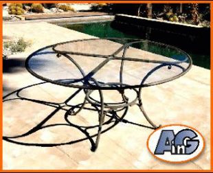 a glass table sitting on top of a patio next to a swimming pool with an orange frame around it