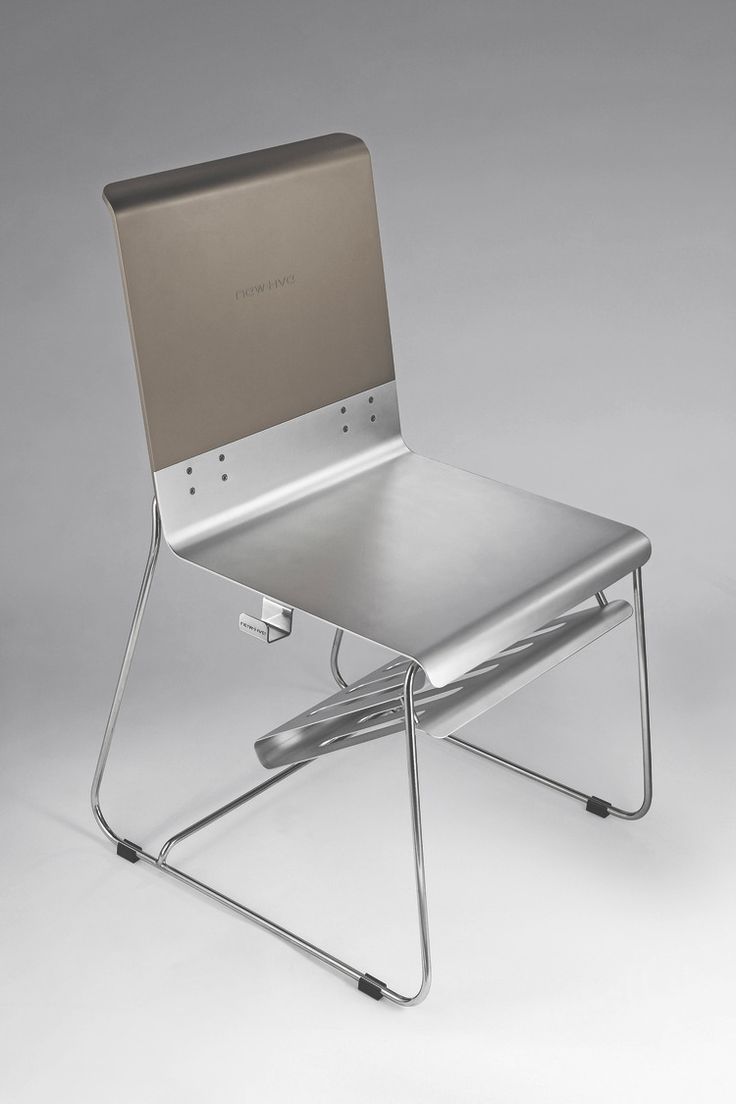 a metal chair sitting on top of a white floor