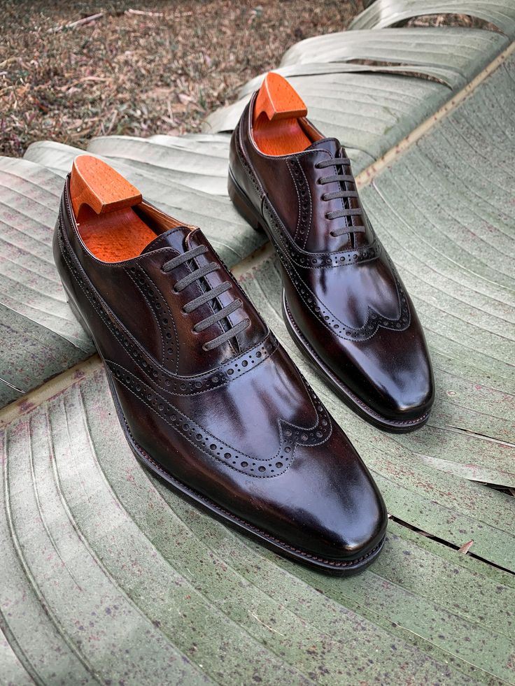 Elevate your formal attire with these timeless Brown Wingtip Oxford Shoes. Meticulously crafted from premium leather, these shoes feature a classic brogue design with intricate perforations, adding a touch of sophistication to any ensemble. The closed lacing system and polished finish ensure a refined look, perfect for business meetings, special occasions, or any event where you want to make a lasting impression. Luxury Wingtip Lace-up Business Shoes, Luxury Wingtip Lace-up Shoes For Business, Timeless Wingtip Oxfords For Formal Occasions, Timeless Formal Wingtip Oxfords, Wingtip Lace-up Shoes With Brogue Detailing For Galas, Gala Wingtip Lace-up Shoes With Brogue Detailing, Wingtip Monk Strap Shoes With Rubber Sole For Galas, Luxury Wingtip Lace-up Shoes For Galas, Timeless Wingtip Dress Shoes For Galas