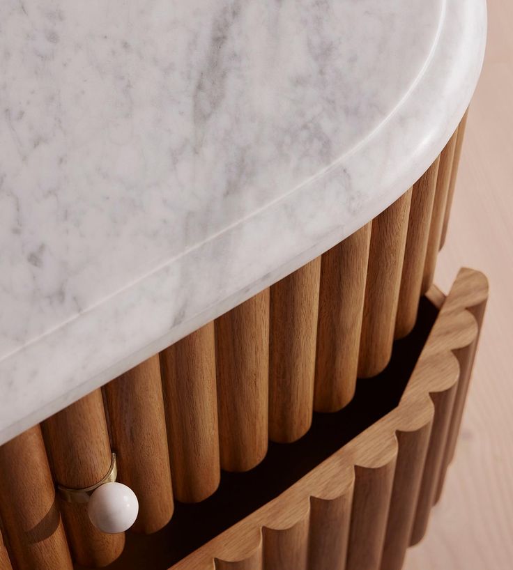 a white marble top on a wooden table