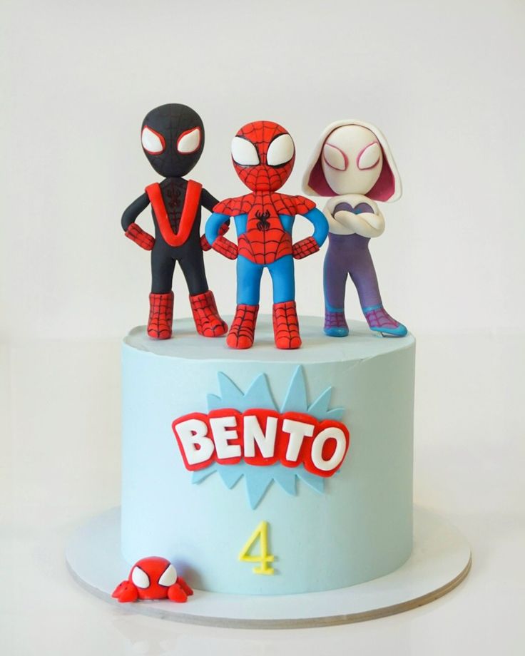 a birthday cake with spiderman figures on top, and the name bento written in large letters