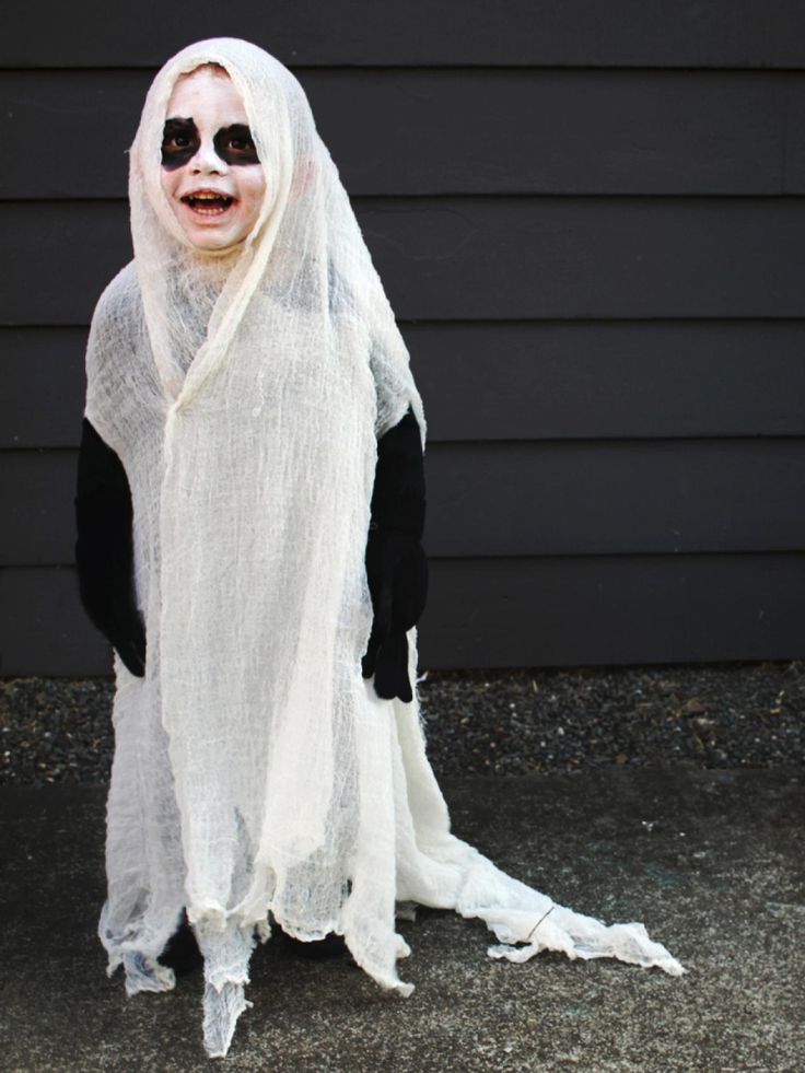 a person dressed up in a ghost costume