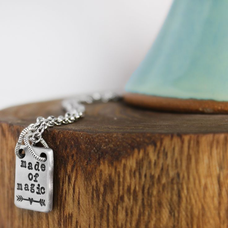 I firmly believe that you are made of magic - and I want you to believe it too!Wear this necklace as a magical reminder of how amazing you are. Lead free pewter rectangle 12mm x 16mm Hand stamped Choose your chain length Adjustable Inspirational Nickel-free Charm Necklace, Inspirational Adjustable Nickel-free Charm Necklaces, Inspirational Stamped Jewelry For Best Friend Gift, Hand Stamped Rectangular Pendant Necklace In Sterling Silver, Nickel-free Dog Tag Charm Necklace For Gift, Hand Stamped Sterling Silver Rectangular Necklaces, Hand Stamped Rectangular Sterling Silver Necklaces, Hand Stamped Sterling Silver Rectangular Necklace, Meaningful Silver Rectangular Jewelry