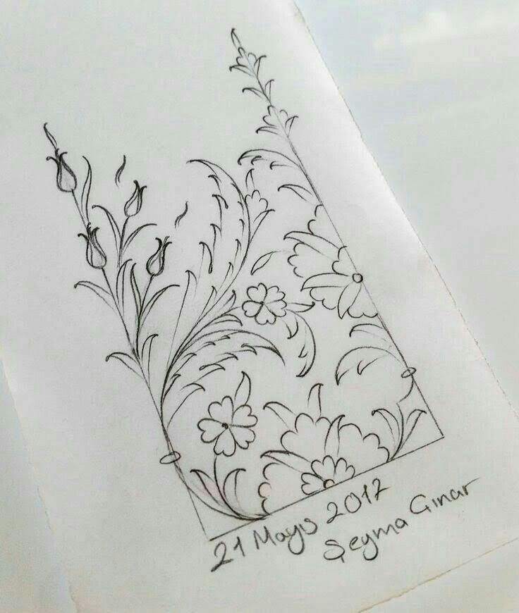 a drawing of flowers and leaves on a piece of paper