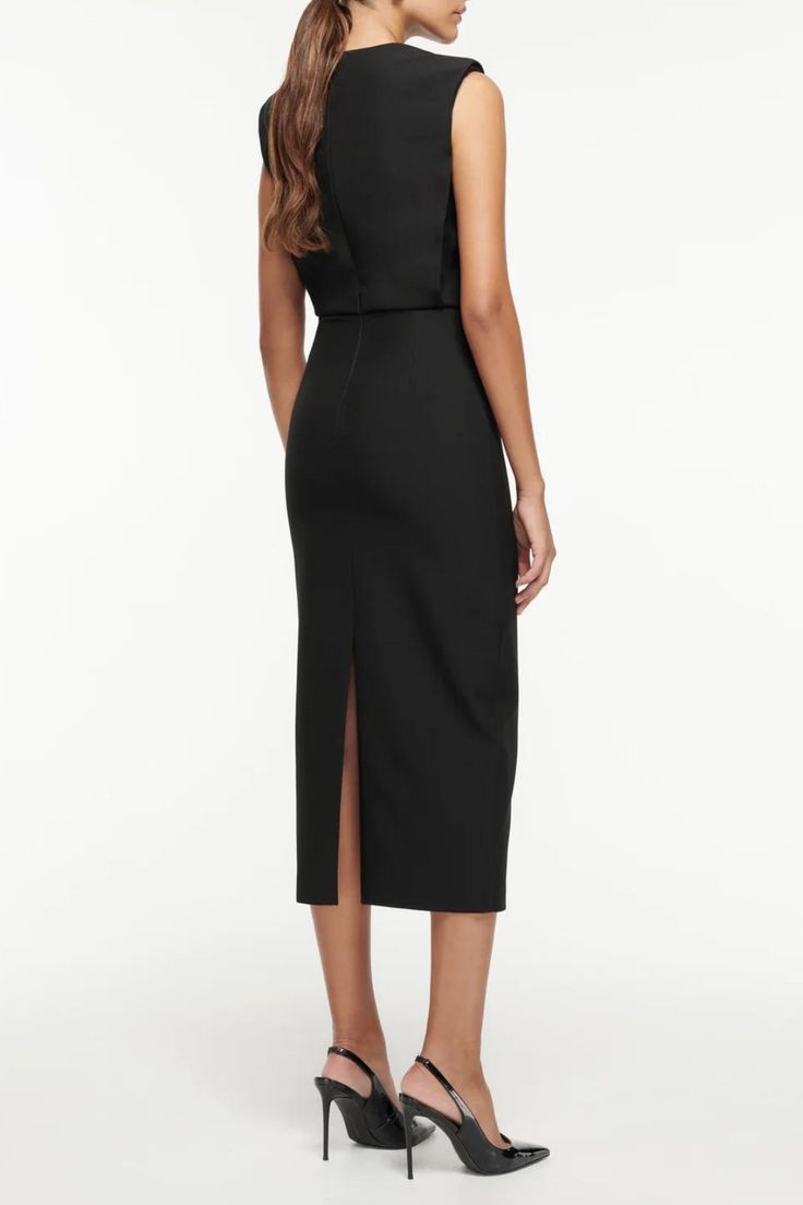 Crepe midi dress with stretch falling to mid calf length in black. Featuring a 'V' neckline shape with diamante trim, removable shoulder pads, a split hem at the back and a concealed zip fastening at the back. Fitted bodice through to a blouson waist and fitted hem V neckline with removable diamante trim shoulder pads Bodice lined Skirt unlined Main Fabric : 84% Polyester, 10% Viscose, 6% Elastane PLEASE NOTE ALL SALE ITEMS ARE FINAL SALE Sleek Midi-length Dress With Flattering Silhouette, Midi Dress With Structured Shoulders For Dinner, Dinner Midi Dress With Structured Shoulders, Elegant Midi Bodycon Dress With Side Slits, Chic Midi Dress With Side Slits For Dinner, Sleek Cocktail Midi Dress With Side Slits, Elegant Asymmetrical Midi Dress With Side Slits, Bodycon Sheath Midi Dress With Side Slits, Sleek Sheath Midi Cocktail Dress