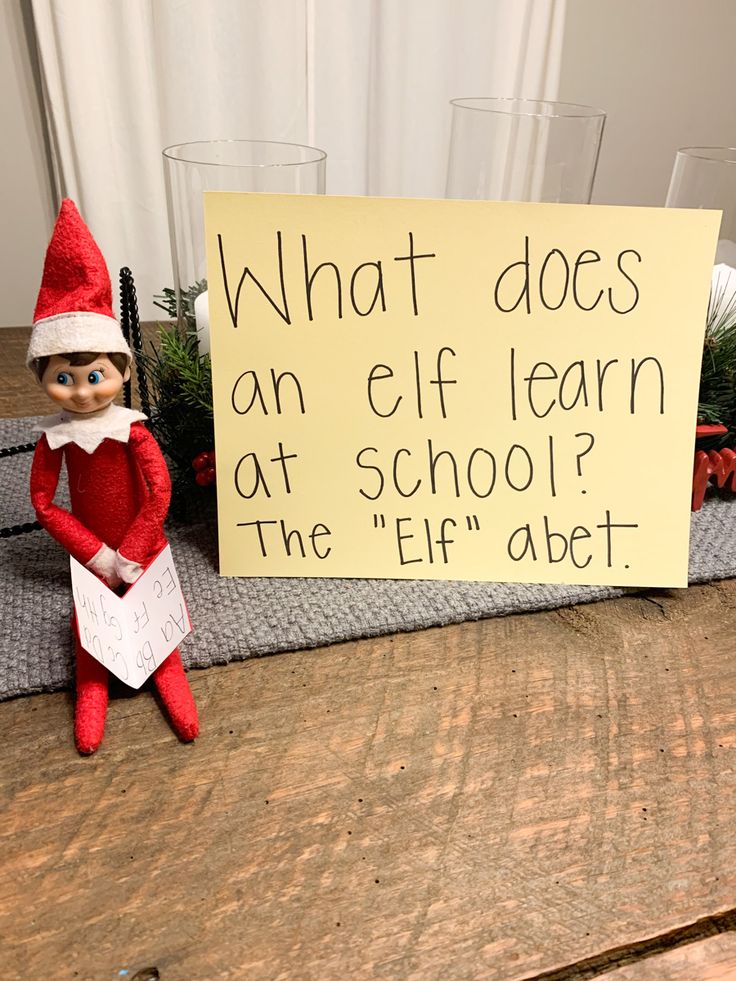 an elf is sitting next to a sign that says what does an elf learn at school?