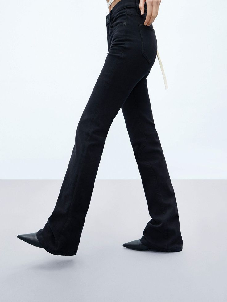 MO&Co. Women's Flared Mid Waist Stretch Jeans These classic jeans are a tried-and-true closet staple. Crafted from a cotton blend with stretch, they fit slim and have flared-cut. The true-black wash will go with pretty much everything. Features : - Flared leg, slim fit, mid-rise, full length- Zip fly, classic five-pocket design Code: MBC3JENK02The back length of size M/27 is 108cmMATERIALS & CARE Material: 68.1% Cotton 23% Polyester 7.4% Viscose 1.5% SpandexPlease reverse mesh bag and washed sep Classic Black Flare Jeans For Office, Classic Black Flare Jeans For Work, Classic Black Straight Flare Jeans, Classic Black Flare Bottoms, Classic Black Flare Jeans, Classic Black Mid-rise Flare Jeans, Classic Cotton Flare Jeans, Black Cotton Flare Jeans With Standard Cut, Black Denim Flare Jeans