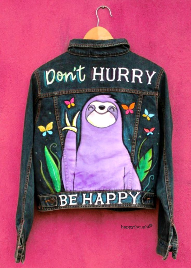 a painted jacket with a slotty on it that says don't hurry be happy