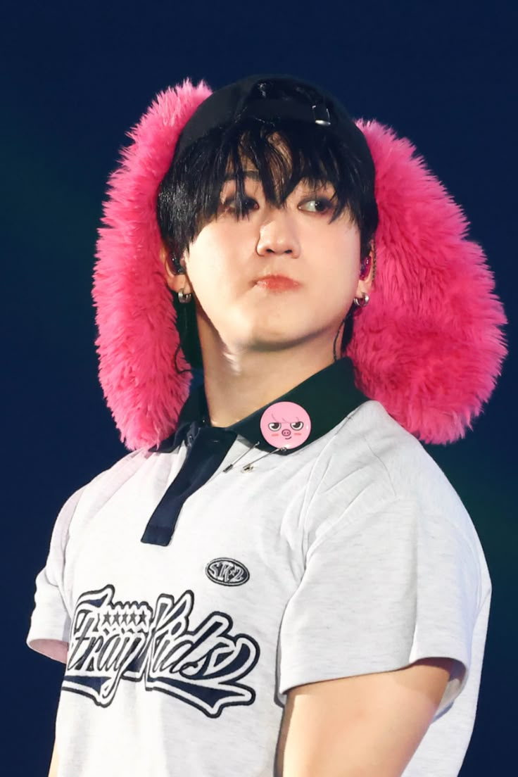 a man with a pink furry hat on his head