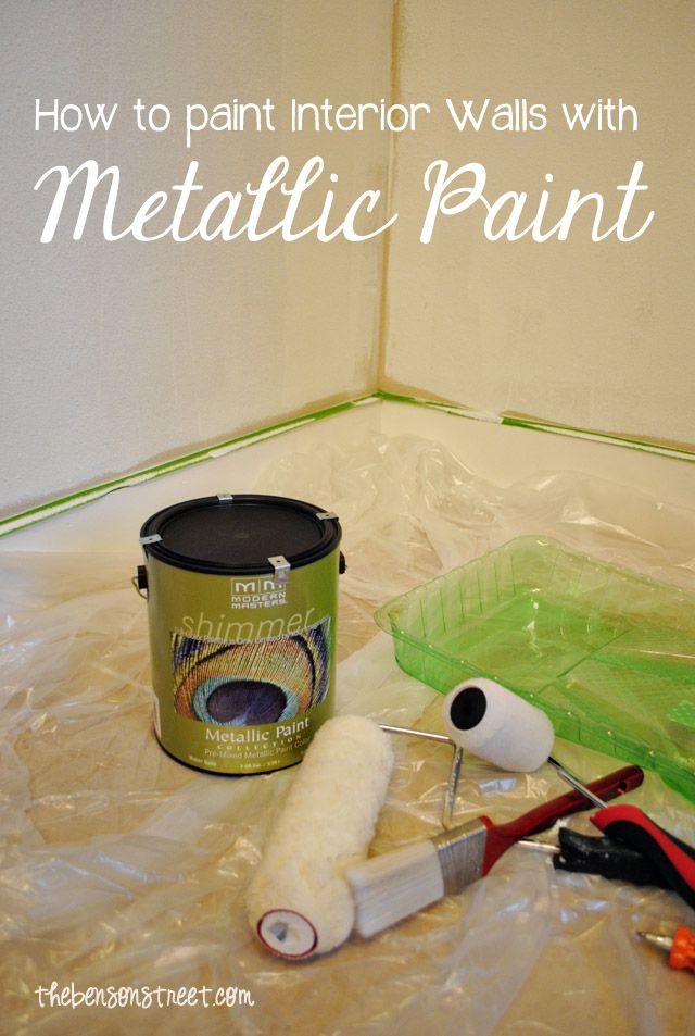 a paint can, brush, and other items are sitting on the floor with plastic wrap around it