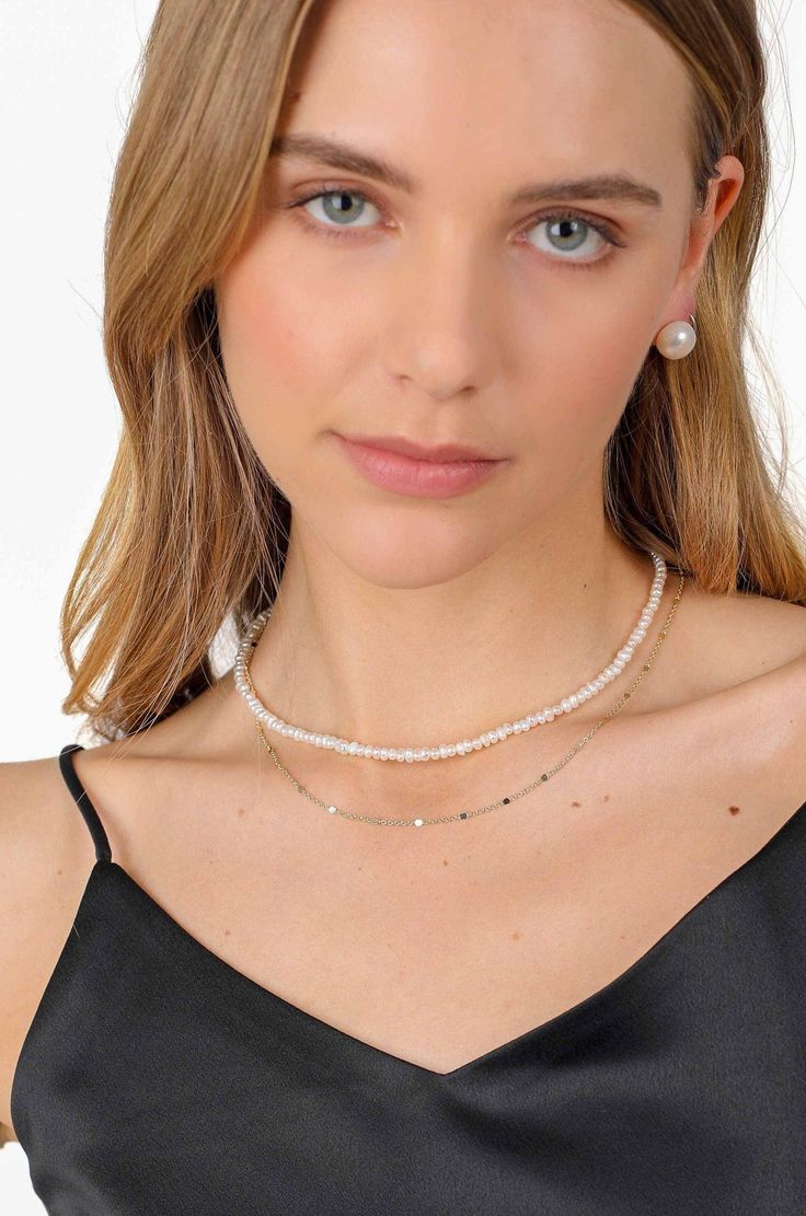 PRODUCT DESCRIPTION Stacked jewellery is going nowhere, fast. Let Kasey Double Layered Pearl Necklace do the hard work for you. This is an exceptionally unique piece as no two freshwater pearls are the same. This choker features tiny freshwater pearls traditionally strung, with a layer of long-lasting 14k Gold-filled chain. They come together to look both effortless and perfected at the same time. You are fine to shower in our gold-filled jewelry. Get it wet, and wear it for life! High Quality P Double Strand Pearl White Jewelry, Pearl White Double Strand Pearl Chain Jewelry, Double Strand Pearl White Jewelry With Pearl Chain, Double Strand Pearl White Pearl Chain Jewelry, Delicate Double Strand Pearl Jewelry, Minimalist Pearl Jewelry With Tiny Beads, Pearl White Jewelry With Tiny Beads, Pearl White Pearl Jewelry With Tiny Beads, Pearl Jewelry With Tiny Beads For Gift