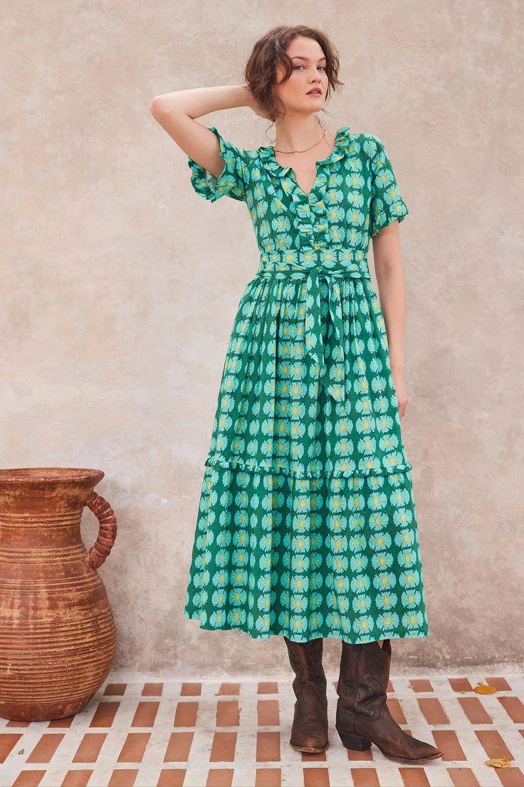 The Naomi dress is a chic addition to your wardrobe. A perfect choice for brunch to cocktails. The exclusive Harlan print in shades of hunter green, lime and turquoise is 100% cotton. The ruffled short sleeves, neckline and the bottom flounce add a feminine flair to this maxi style. Tie the sash in a bow and you are ready to go. Bella Tu is a luxury resort collection that reflects a modern fusion of ancient Indian motifs and embellishment traditions of hand beading, embroidery and block printing. Each bella tu style in the collection is designed and crafted with care. Tara Dress, Indian Motifs, Beading Embroidery, Pre Fall Collection, Daytime Dresses, Maxi Styles, Resort Collection, Vacation Dresses, Block Printing