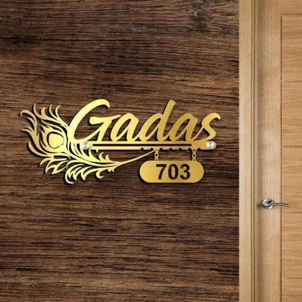 a door with the name gadas on it and a sign that reads'703 '