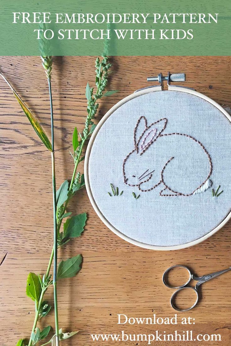 the embroidery pattern is being worked on with scissors and thread to make it look like a bunny