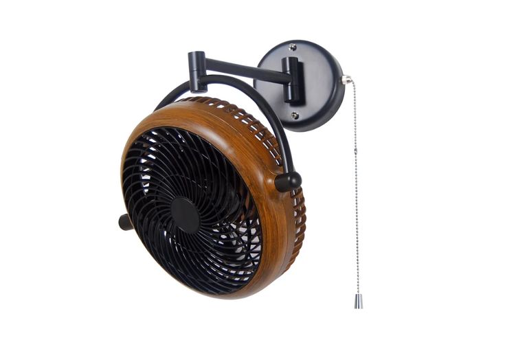 the wall mounted fan is attached to the side of the wall and has a hook on it