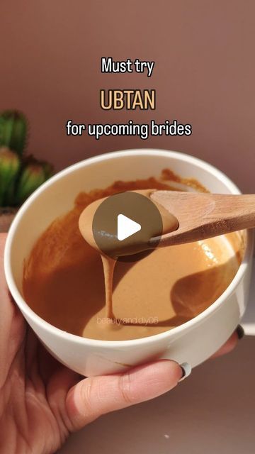 a person is holding a spoon in a bowl with caramel sauce on it and the words must try urban for upcoming brides