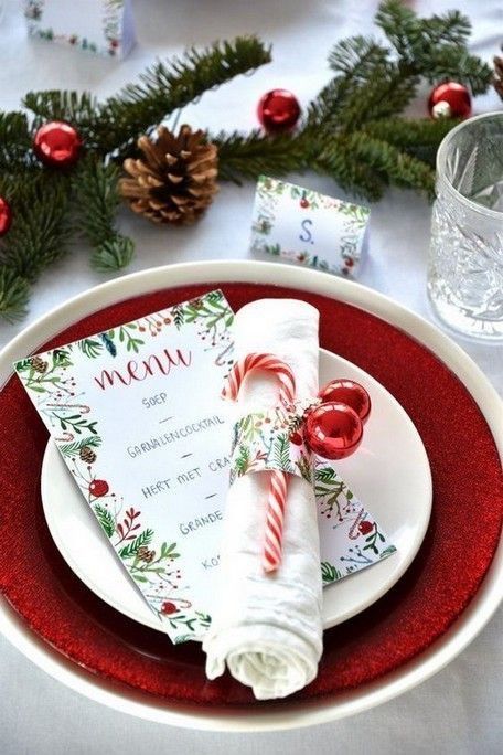 a white plate topped with a candy cane napkin