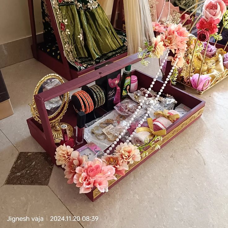 an elaborately decorated vanity with flowers and jewelry