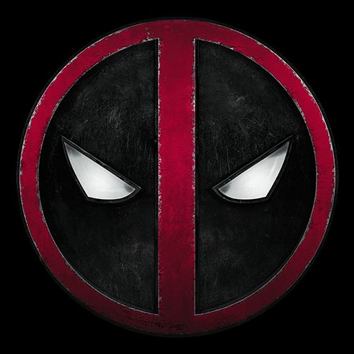 a black and red deadpool button with white eyes on the bottom, in front of a white wall