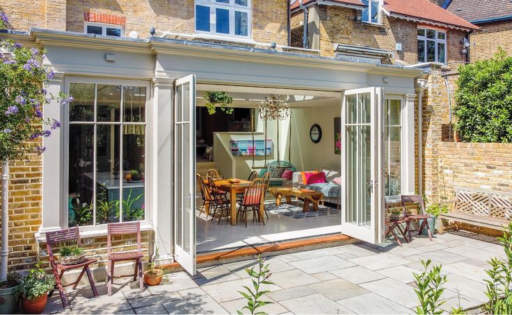 an open patio area with chairs and tables