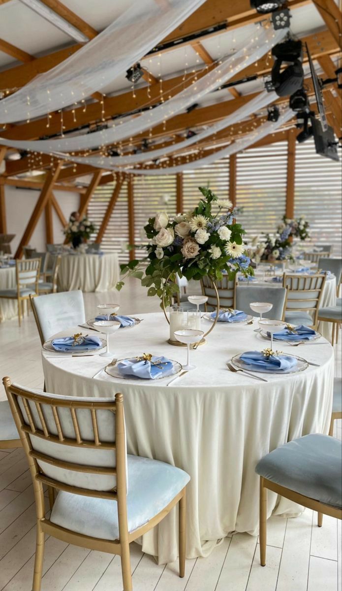 the tables are set with blue and white place settings