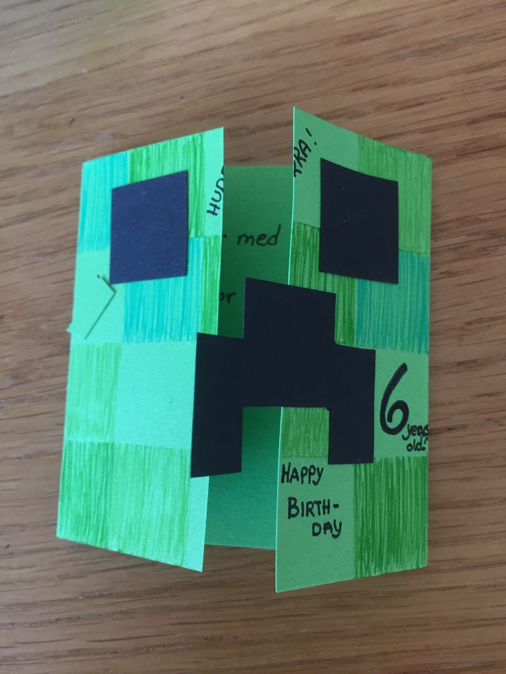 a piece of paper that has been cut out to look like a minecraft birthday card