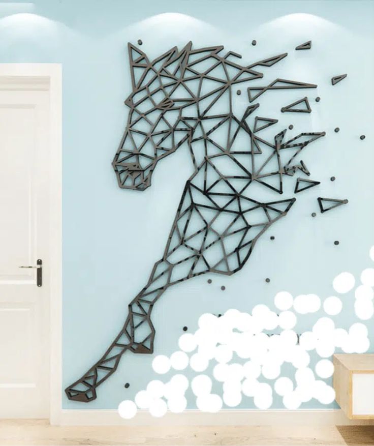 a horse made out of geometric shapes on a wall