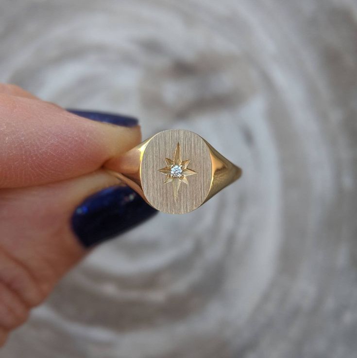 Our solid gold starburst signet ring features a cosmic star set with a sparkling diamond. Choose from 14k, 18k yellow, rose, white gold or platinum. Prefer a colored gemstone in place of the diamond? Just leave us a note at checkout. This ring is a lovely addition to your celestial fine jewelry, and makes a meaningful, timeless (and cool!) gift for your loved ones this holiday season. Details: - Made at our family-run studio in NYC. - Solid 14k, 18k yellow, rose, white gold or platinum -- choose Star Shaped Signet Ring With Polished Finish, Celestial Style Single Diamond Ring, Star-shaped Signet Ring For Promise - Fine Jewelry, Star Shaped Fine Jewelry Signet Ring For Promise, Celestial Diamond Jewelry With Single Diamond, Celestial Gold Signet Ring Stamped 14k, Gold Celestial Signet Ring Stamped 14k, Star-shaped Single Diamond Jewelry For Anniversary, Celestial Style Diamond Signet Ring In Yellow Gold