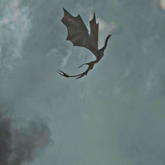 a dragon flying through the sky with its wings spread