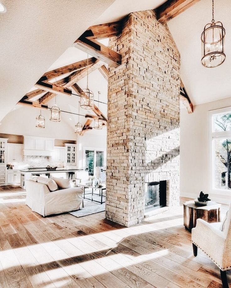 a living room filled with furniture and a fire place