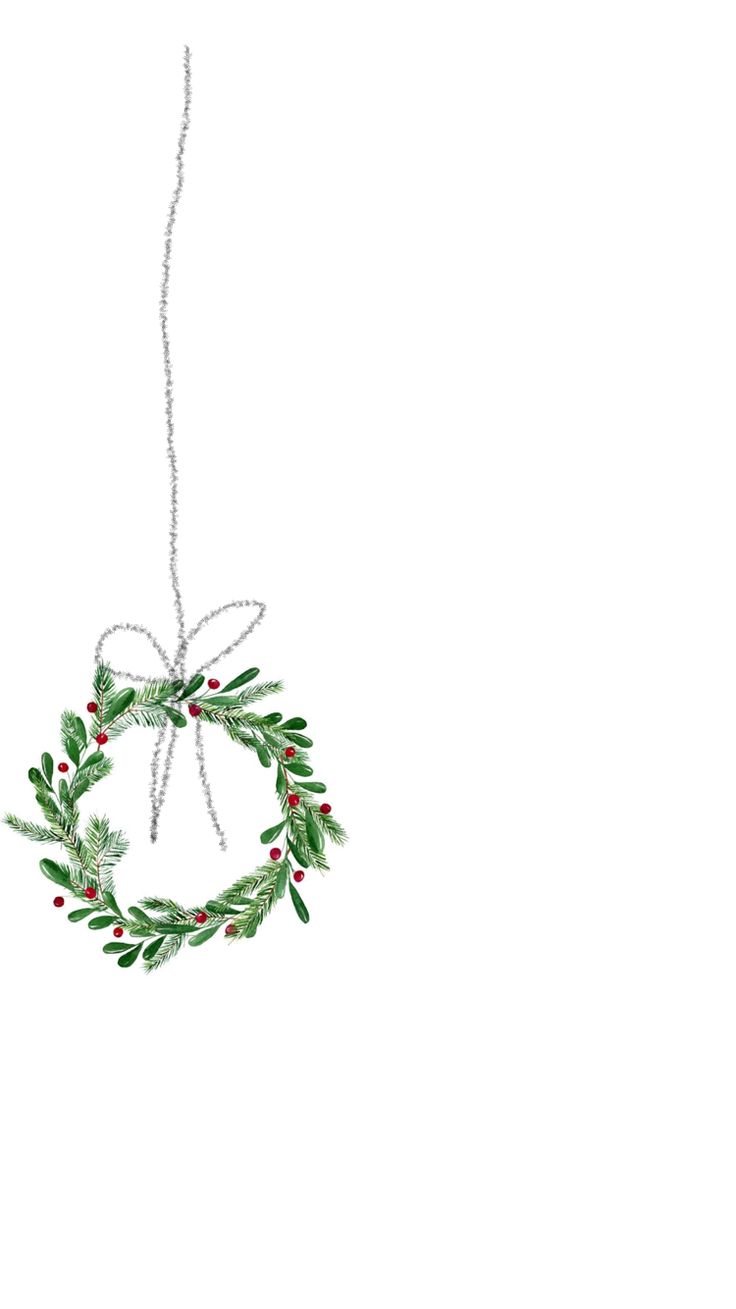 a christmas ornament hanging from a string with holly leaves and berries on it