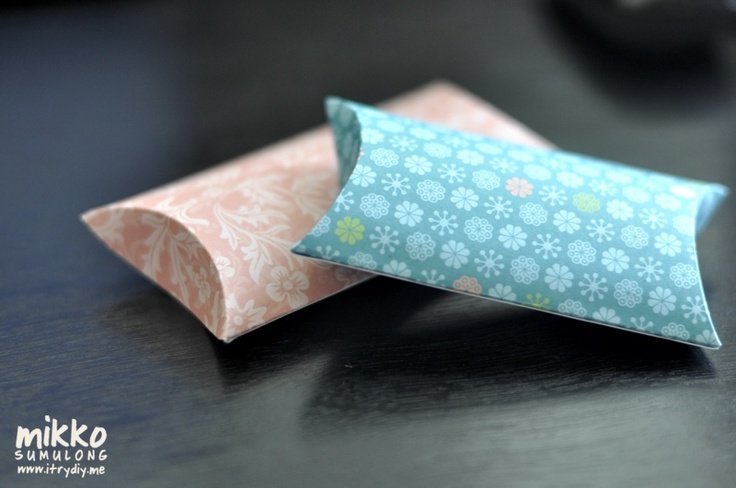 an origami pillow sitting on top of a table