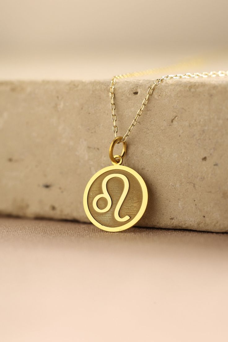 Gold Leo Zodiac Pendant - Leo Zodiac Gold Necklace ● Material of pendant: Solid Gold 14k ( REAL GOLD ) ● Metal Stamp: 14k ( REAL GOLD ) ● The pendant is available in 5 sizes: - 12,7 mm / 0.5 inches (Diameter) - 14,0 mm / 0,55 inches ( Diameter ) In the photos - 15,3 mm / 0.6 inches ( Diameter ) - 16,5 mm / 0,65 inches ( Diameter ) - 19,1 mm / 0,75 inches ( Diameter ) ( In the photos the size is 14mm / 0.55 inches Diameter ) ( Jump Ring inner diameter: 4 mm ) ● Material of chain: Solid gold 14k ( Lion Necklace Women, Leo Zodiac Necklace, Zodiak Leo, Leo Pendant, Leo Jewelry, Pendant Delicate, Leo Necklace, Gold Finger Rings, Bff Jewelry